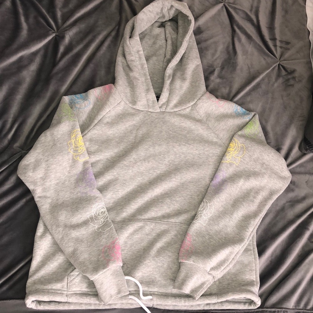 Gray hoodie with flower designs on arms